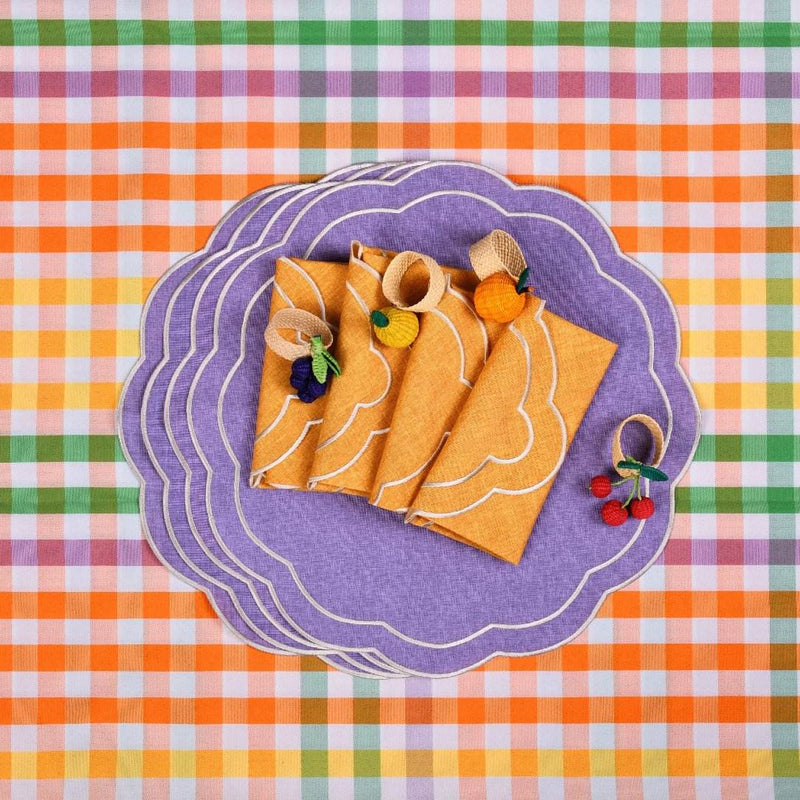 Rainbow Fruits napkin rings by Roseberry Home styled alongside coordinating purple and orange table accessories