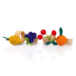 Set of 4 Rainbow Fruits napkin rings by Roseberry Home on white background, featuring lemon, orange, cherry, and grape designs