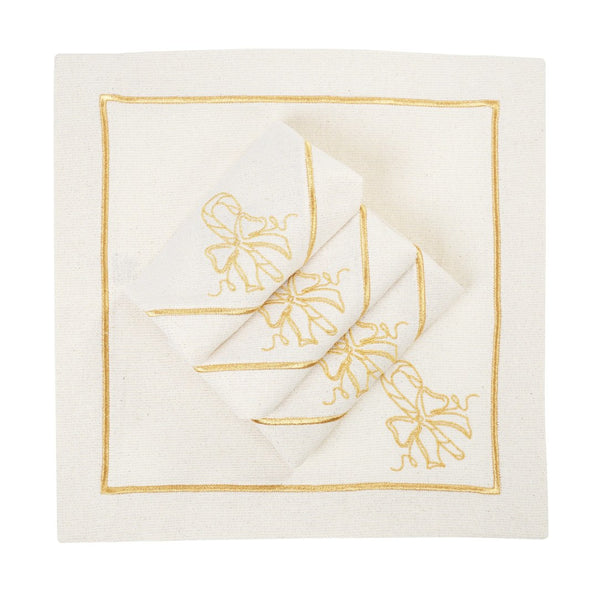 Folded light beige napkins with gold embroidered candy cane motif on white background.