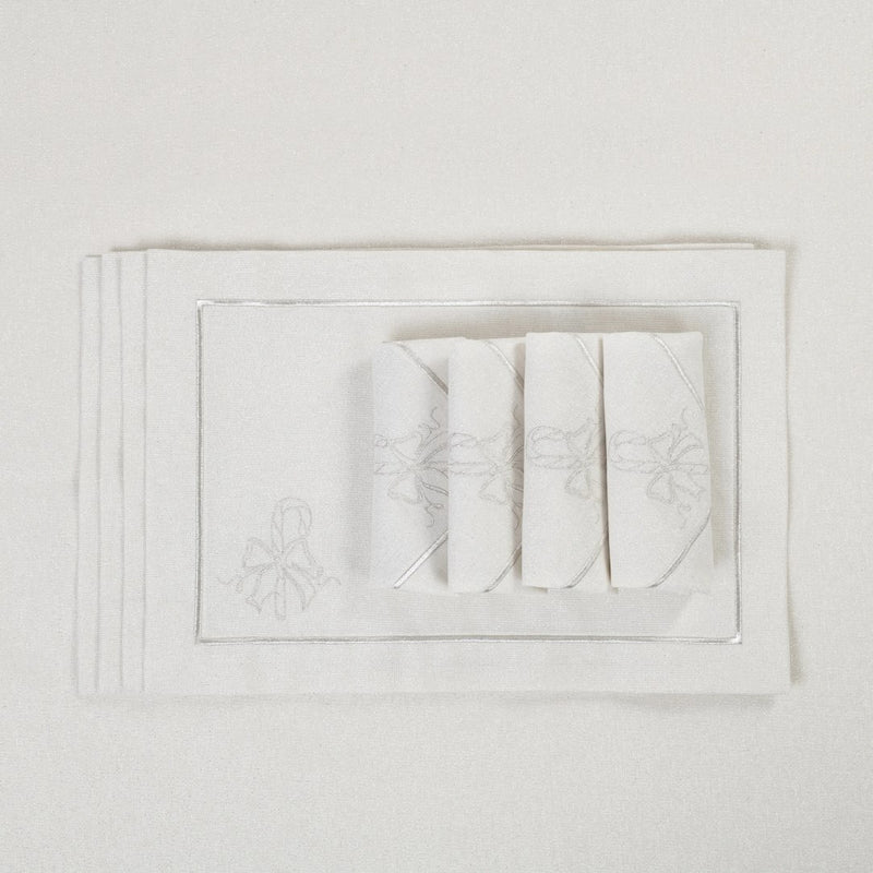 Candy Cane embroidered napkins folded on matching tablecloth.
