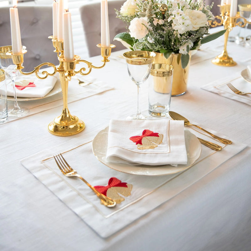 Roseberry Home Jingle Bells napkins with elegant Christmas bell motif on Christmas table setting.
