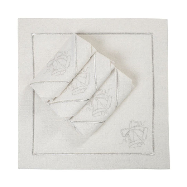 Silver lurex napkin with embroidered bell motif folded on white background. 