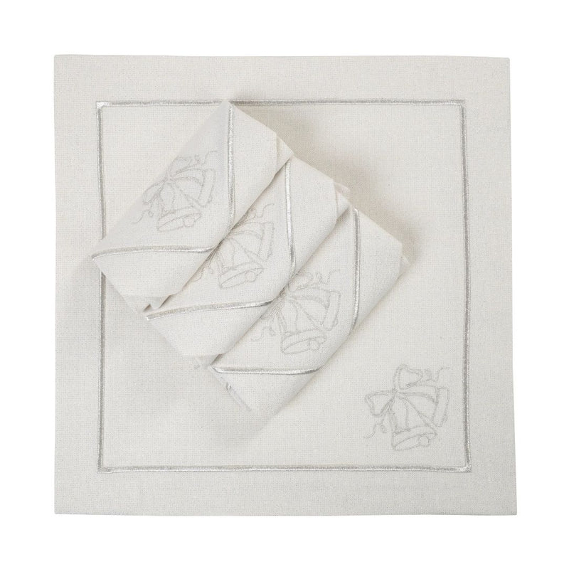 Silver lurex napkin with embroidered bell motif folded on white background. 