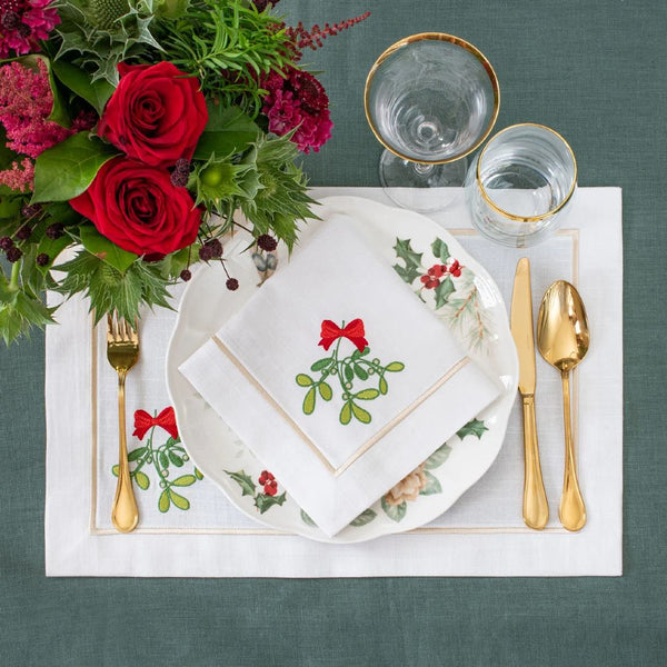 Mistletoe Panama napkin gracefully set on a luxurious Christmas holiday table.