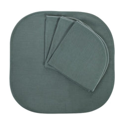 Folded Royal Green linen napkins with piped edge on white background, soldby Amiramour.