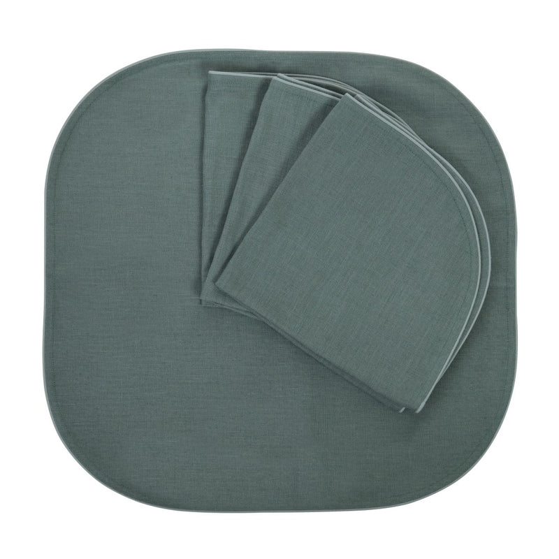 Folded Royal Green linen napkins with piped edge on white background, soldby Amiramour.