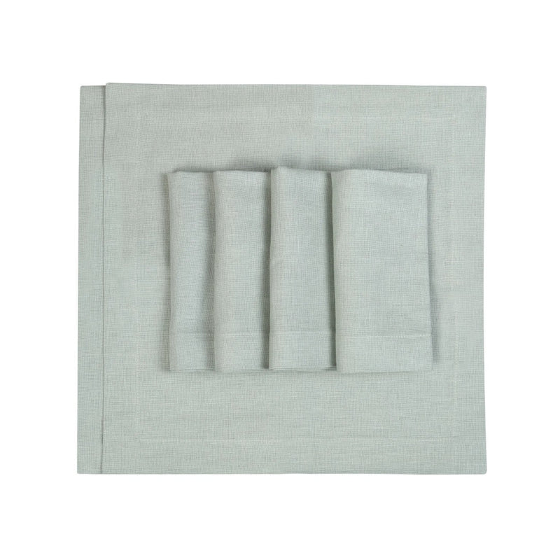 Top view of light green linen napkins by Roseberry Home neatly folded on white background.