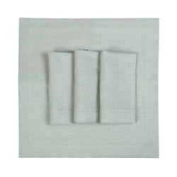 Set of 6 light green linen napkins by Roseberry Home neatly folded on white background, sold at Amiramour.
