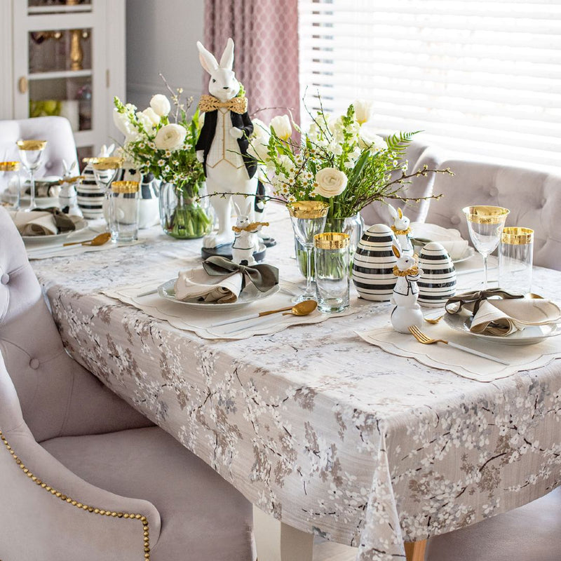 Silver embroidered napkin by Roseberry Home with plate and cutlery, styled top view on Easter table 