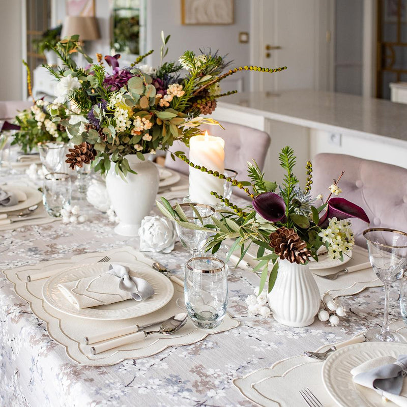 Silver embroidered napkin styled with plate and cutlery, side view on classic table, sold by Amiramour