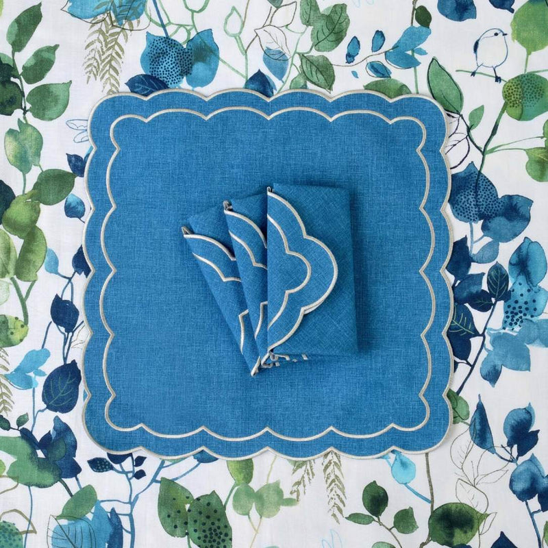 Set of six Blue Petali napkins with wave borders on tablecloth from the same collection, sold at Amiramour.