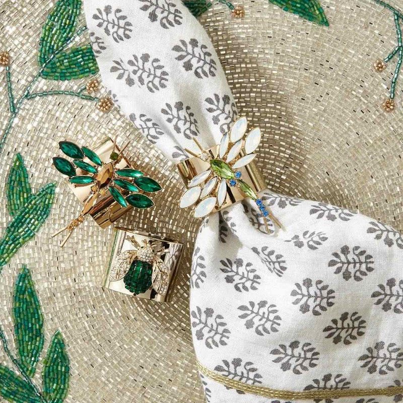 Opal glass Dragonfly Napkin Ring by Joanna Buchanan styled on a white napkin
