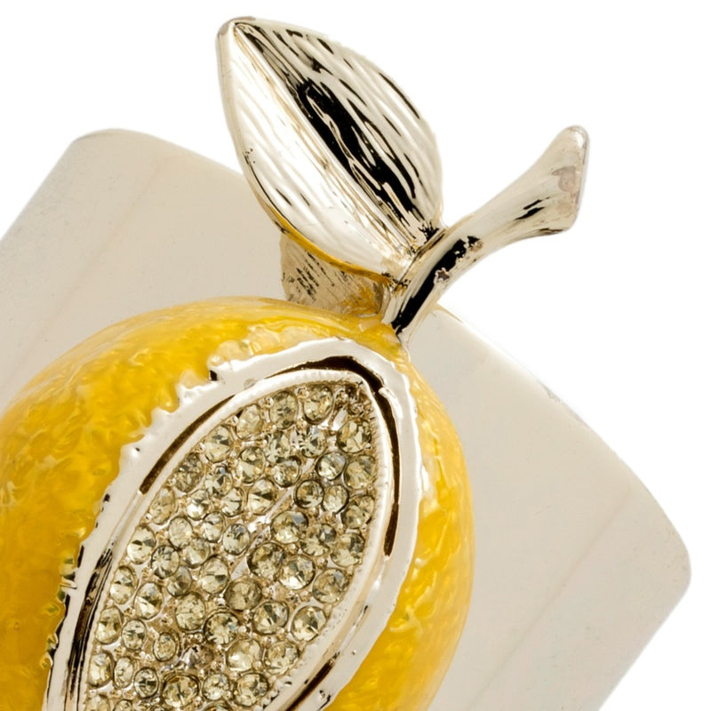 Close-up of Lemon Napkin Ring by Joanna Buchanan, showing intricate lemon shape with sparkling stones on a metal ring