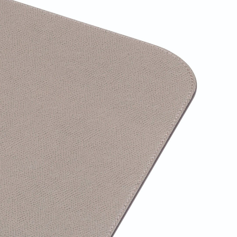 Vanny leather placemat in grey with one stitching row by Giobagnara close-up.