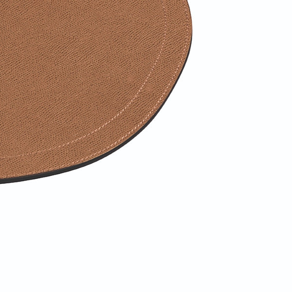 Oval leather double-stitch placemat in tan brown by Giobagnara close-up on stitching.