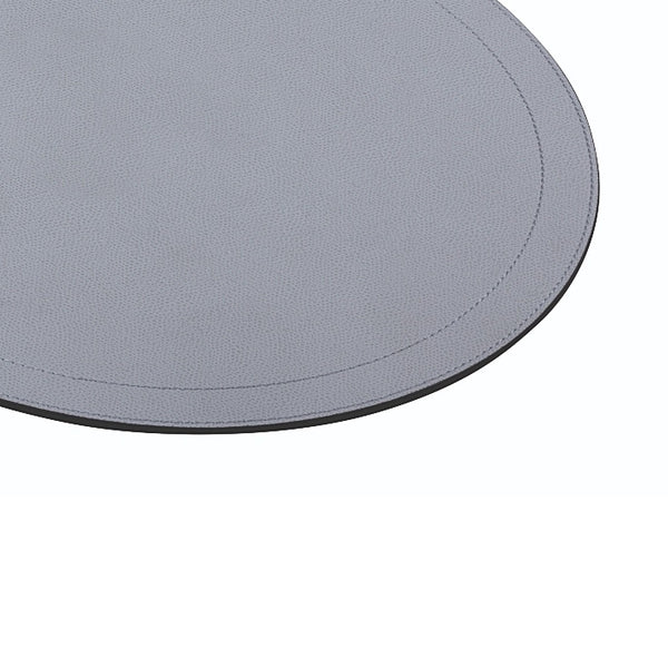 Round leather placemat with two stitching rows by Giobagnara close-up.