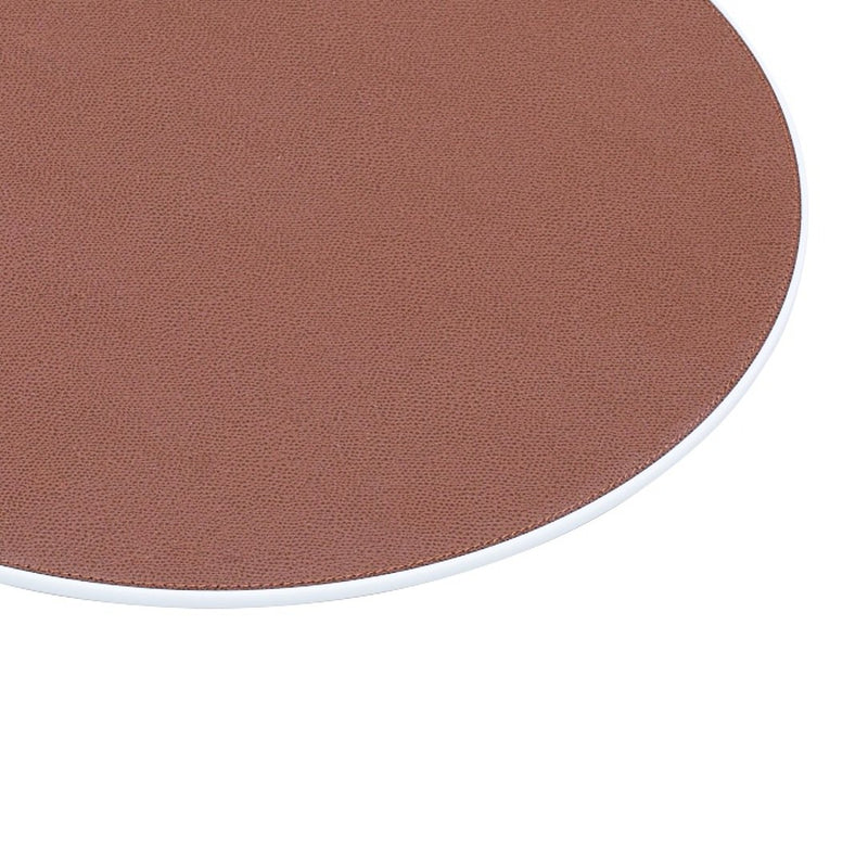 Round Corian placemat with leather insert by Giobagnara close-up.