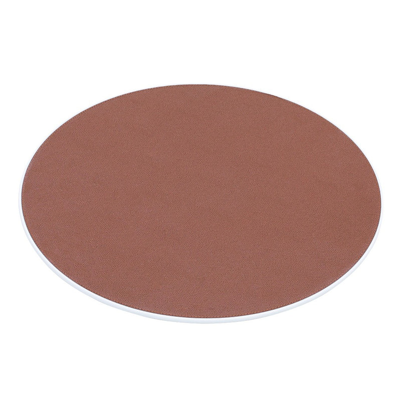 Round Corian placemat with leather insert by Giobagnara.