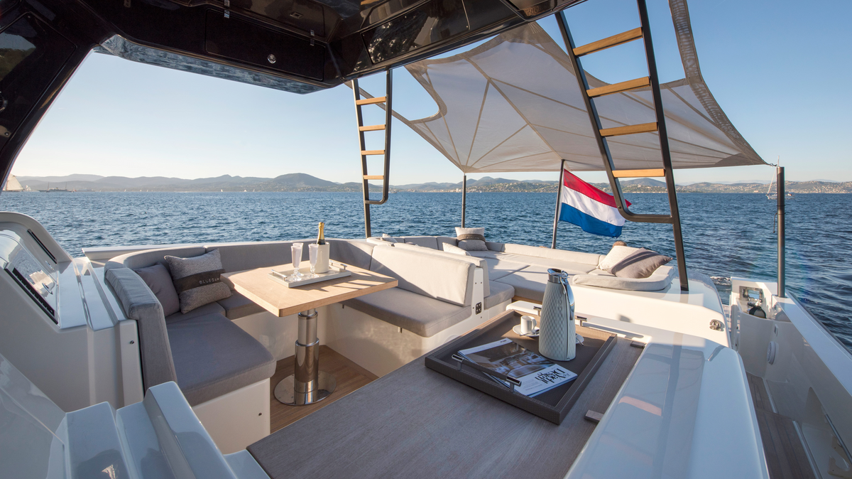 Superyacht dining table restocked with luxury yacht tableware, crystal glassware and linen before the charter season