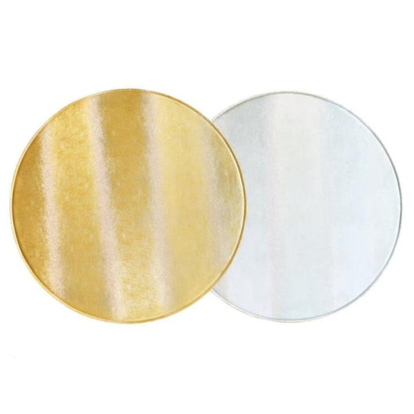 Reversible faux leather placemat in silver and gold by Von Gern Home.
