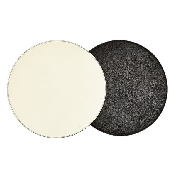 Reversible placemat in black and off-white faux leather by Von Gern Home.