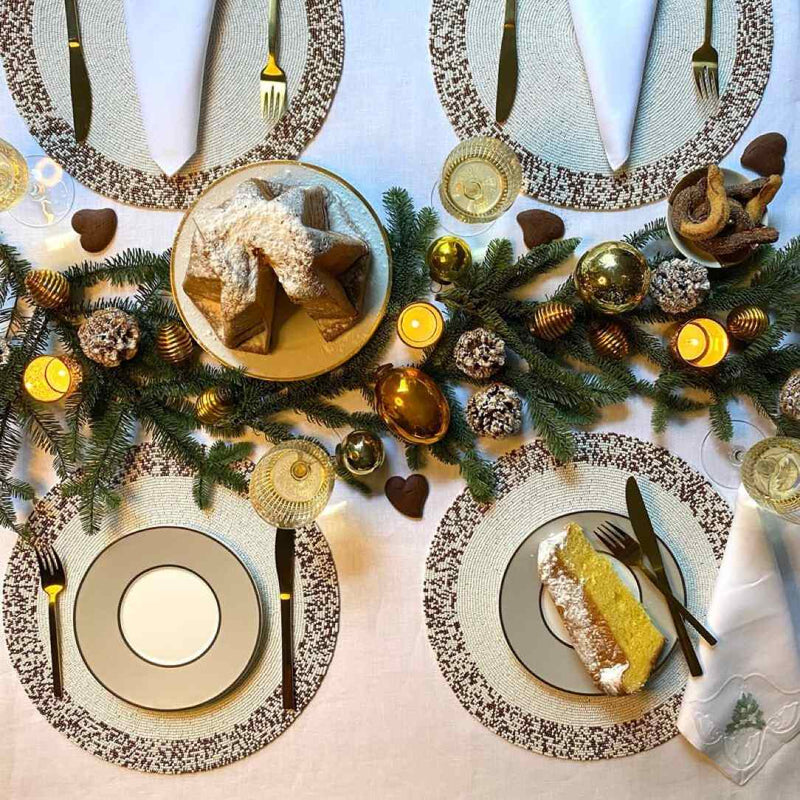 Von Gern Home Splatter placemat in bronze and white beads styled Christmas tablescape.