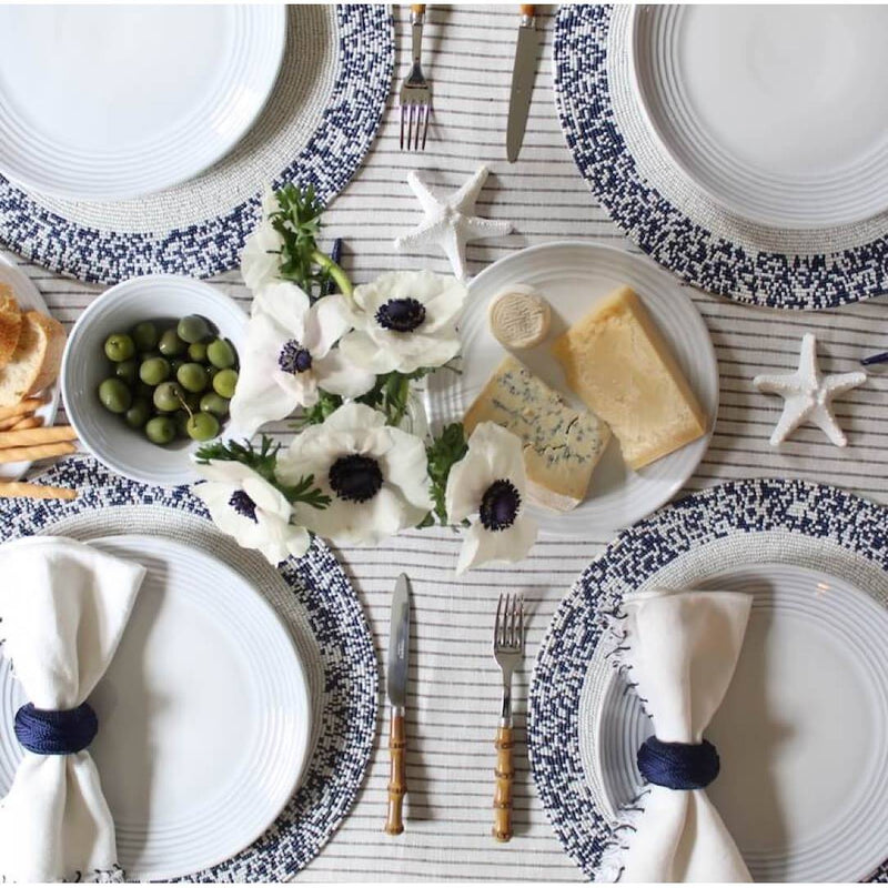 Hand-beaded placemat in navy and white beads seaside table setting.