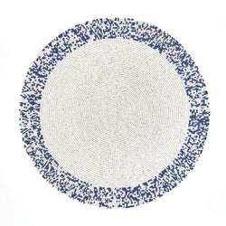 Hand-beaded placemat in navy and white beads by Von Gern Home.