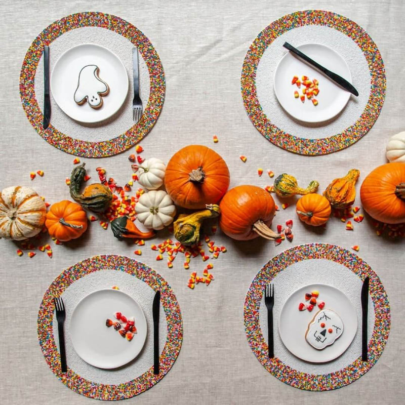 Von Gern Home Sprinkles placemat with colorful bead border styled on Halloween playfull table.