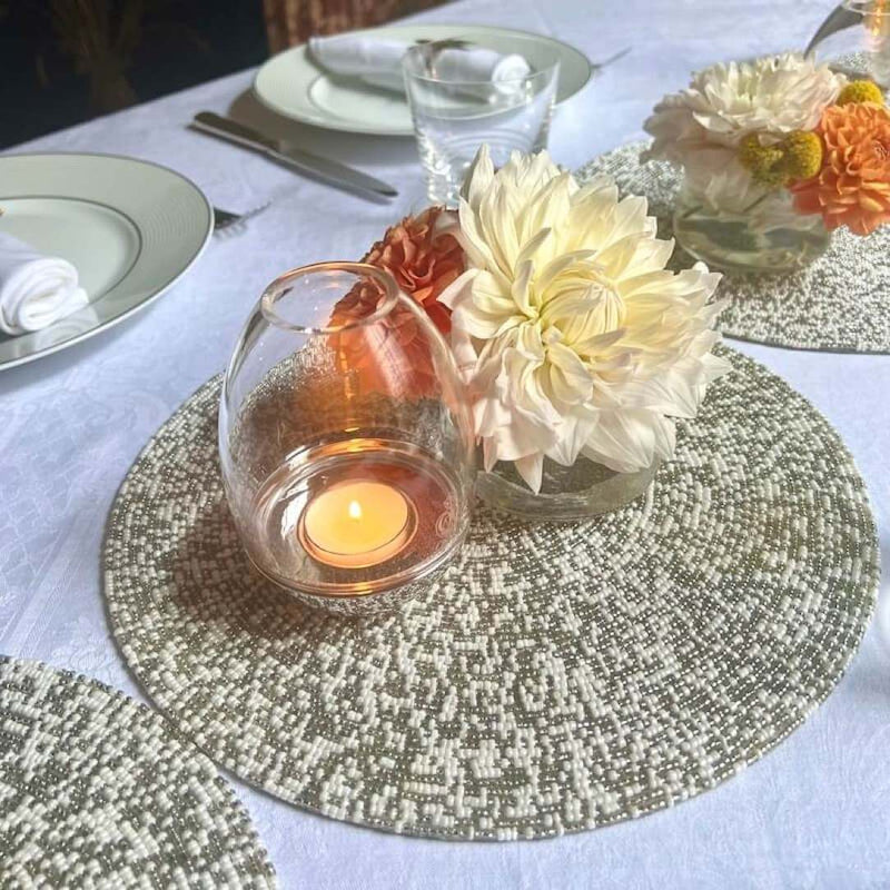 Speckle decorative mat with silver and white hand-beaded design luxury centrepiece.
