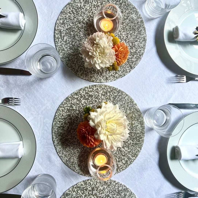 Speckle decorative mat with silver and white hand-beaded design styles as centrepieces.