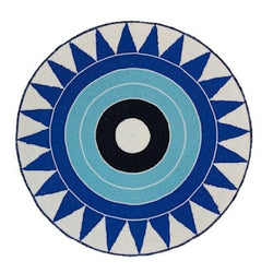 Blue hand-beaded placemat with tribal pattern by Von Gern Home.