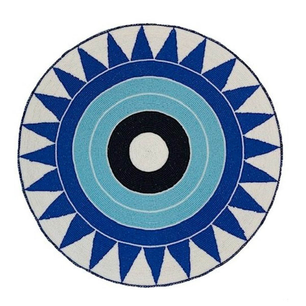 Blue hand-beaded placemat with tribal pattern by Von Gern Home.