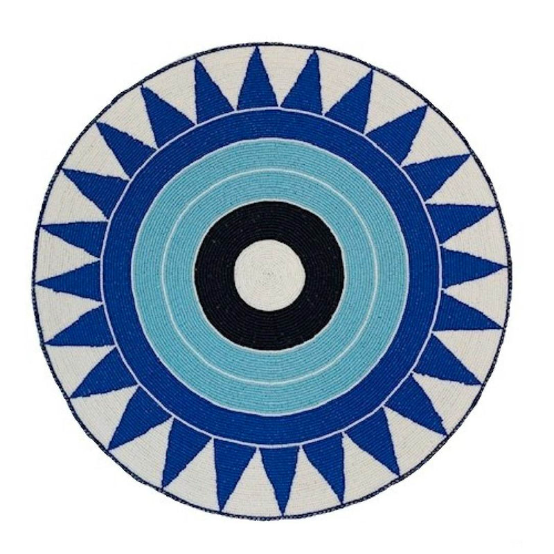 Blue hand-beaded placemat with tribal pattern by Von Gern Home.