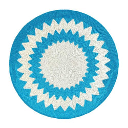 Blue and white hand-beaded placemat in Mediterranean style by Von Gern Home.