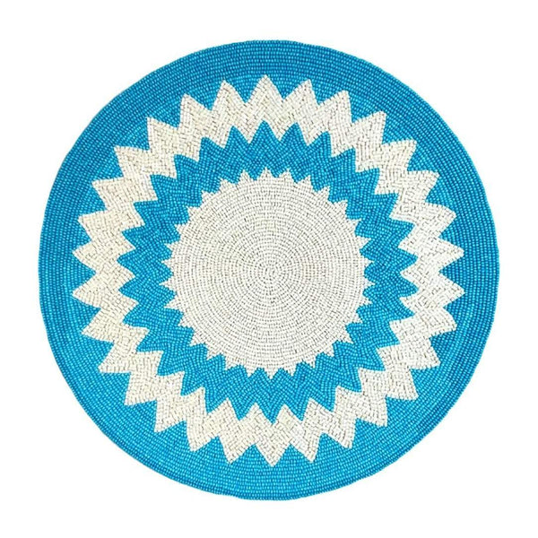 Blue and white hand-beaded placemat in Mediterranean style by Von Gern Home.