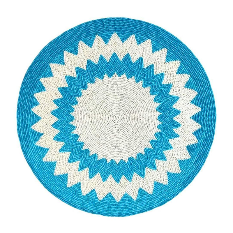Blue and white hand-beaded placemat in Mediterranean style by Von Gern Home.