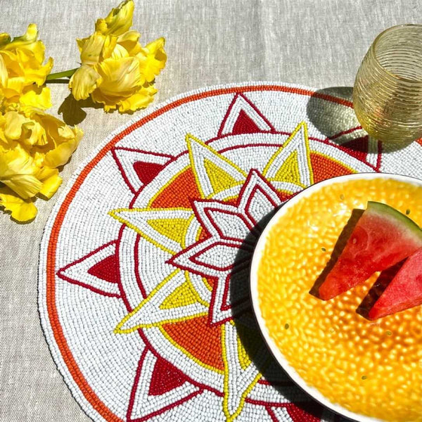 Ibiza hand-beaded placemat by Von Gern Home on summer table.