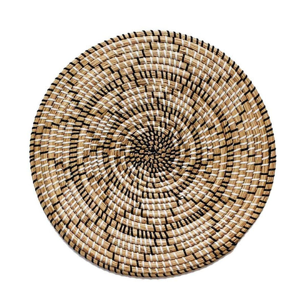 Terra woven placemat in seagrass with black and white strands by Von Gern Home.