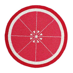 Grapefruit hand-beaded placemat in reddish-pink by Von Gern Home.