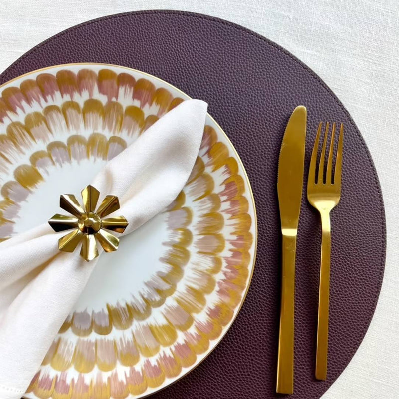 Reversible placemat in tan brown and plum red faux leather burgundy side styled.