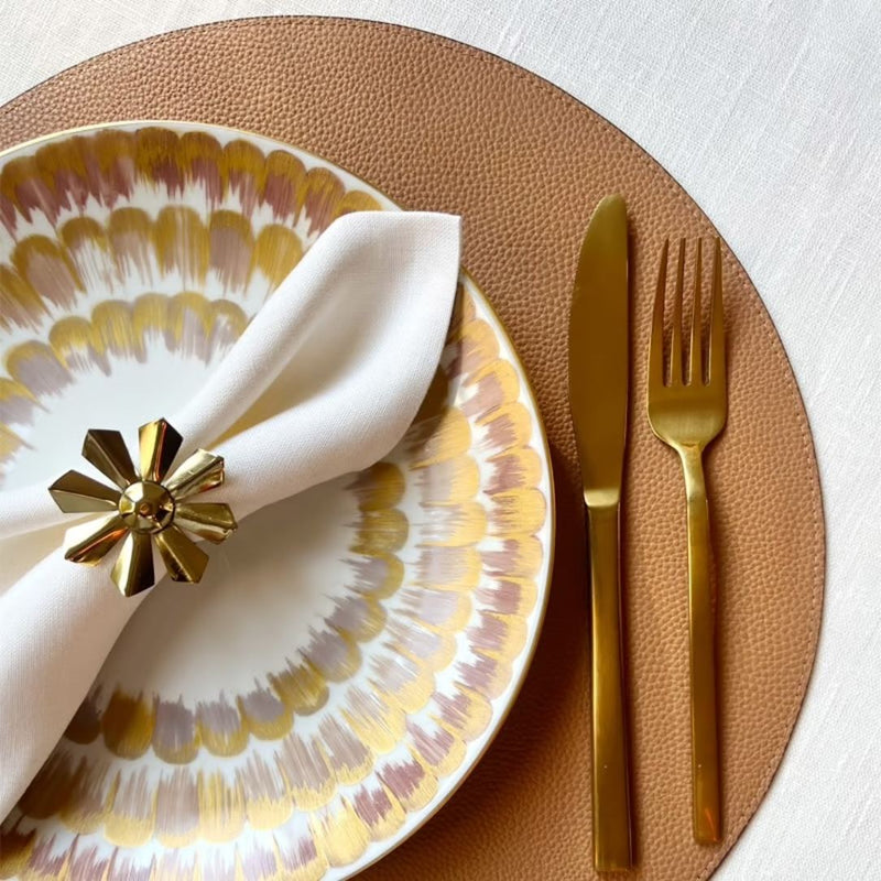 Reversible placemat in tan brown and plum red faux leather tan side styled.