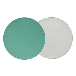 Reversible placemat in turquoise and white faux leather by Von Gern Home.