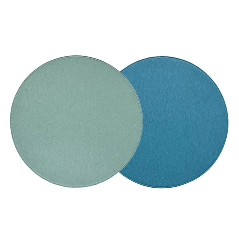 Reversible placemat in sky blue and light blue faux leather by Von Gern Home.
