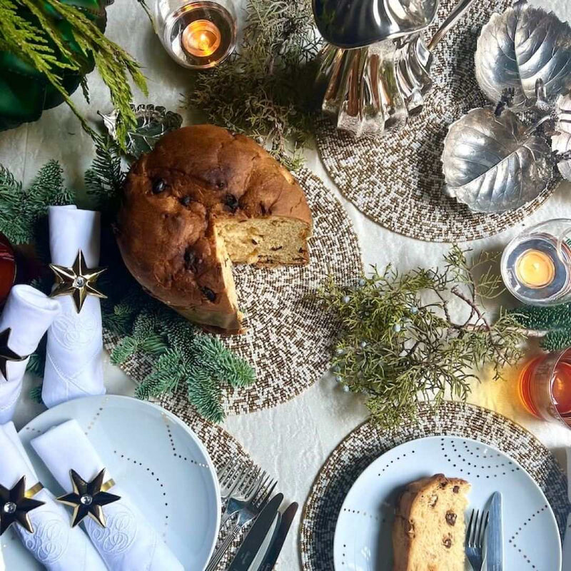 Gold and white Speckle hand-beaded decorative mat by Von Gern Home on festive luxe table setting.