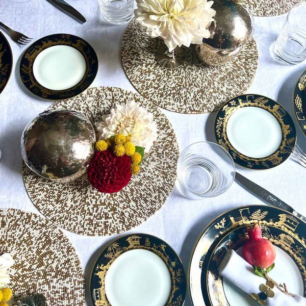 Gold and white Speckle hand-beaded decorative mat by Von Gern Home on luxurious tablescape.