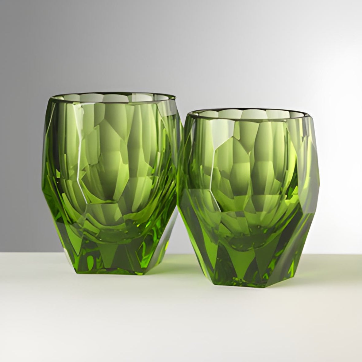 Two green Acrylic crystal tumblers Milly inspired by baroque and pop art by Mario Luca Giusti with a gray background