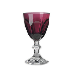 A single ruby red acrylic water glass with a clear base, part of the 'DOLCE VITA' collection by Mario Luca Giusti.