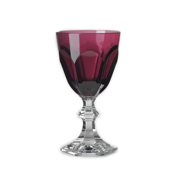 A single ruby red acrylic water glass with a clear base, part of the 'DOLCE VITA' collection by Mario Luca Giusti.