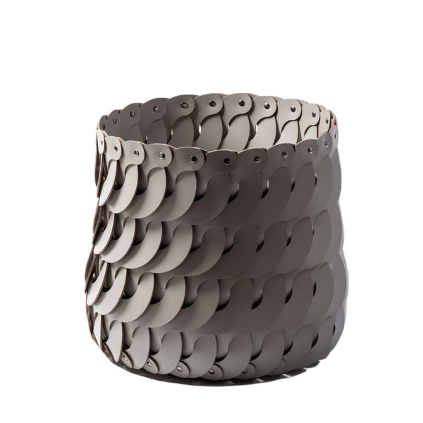 Alicante Tall Round Basket by Pinetti, crafted in regenerated leather with a sculptural interlocking design. Elegant, functional storage in Antibes leather colours.